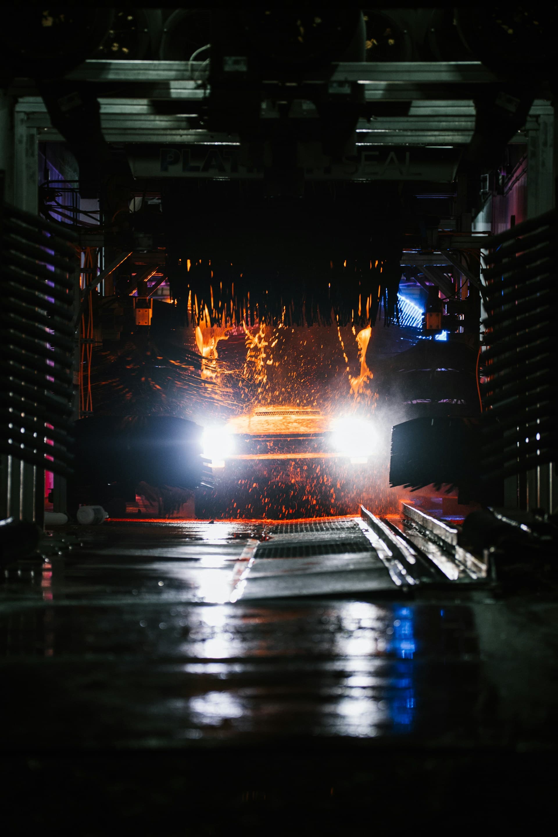 Car being cleaned inside the automatic car wash